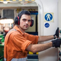 Mechanic in orange work clothes